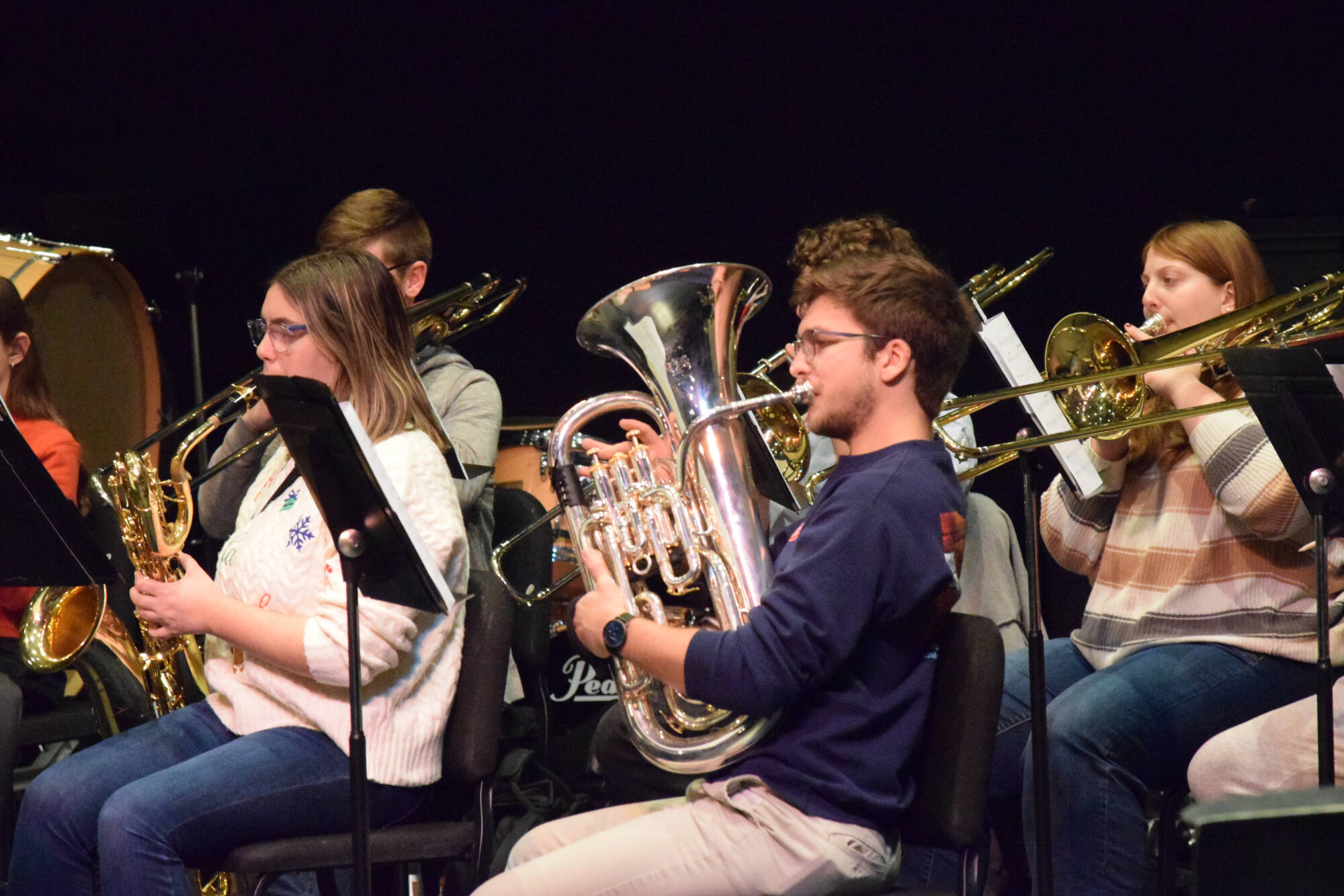 Student playing a horn
